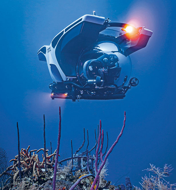Scenic Neptune I diving above ocean reefs