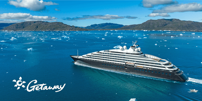 Scenic Eclipse ship on the water with a getaway logo