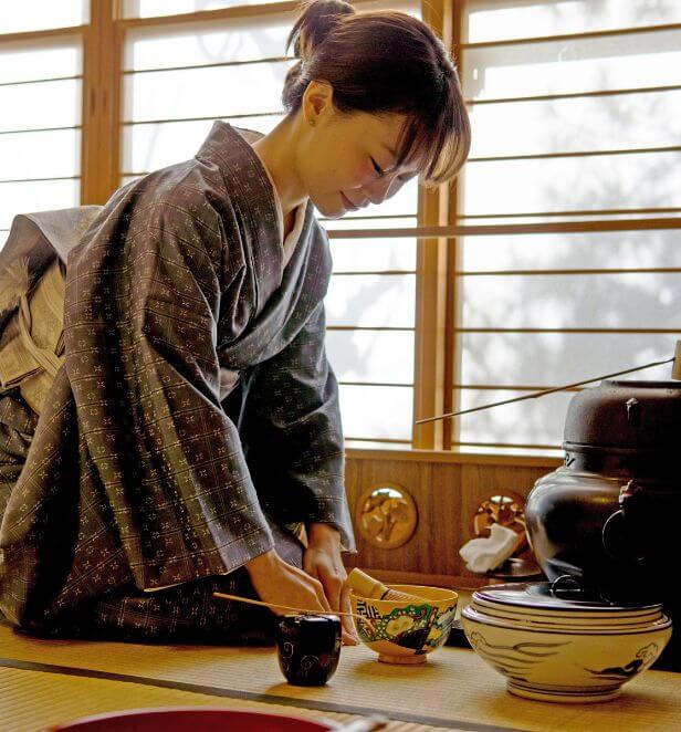 Traditional tea ceremony in Kyoto with woman in kimono