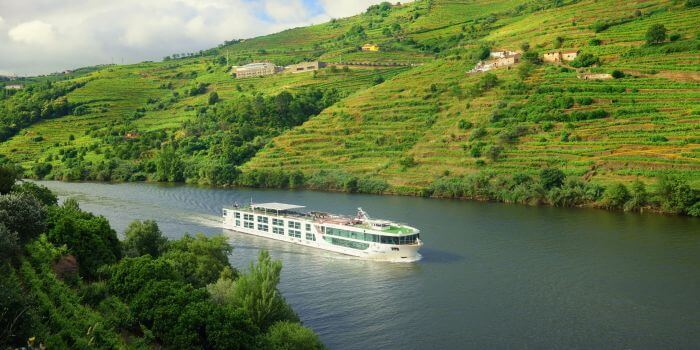 Scenic Azure cruising through the lush terraced hills of the Douro Valley, Portugal