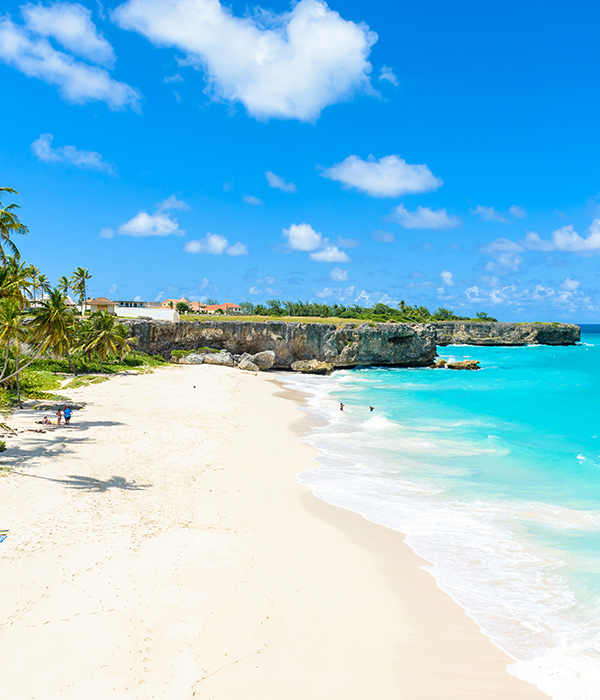 A Caribbean beach on a sunny day with blue skies